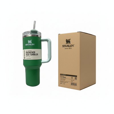 Green Stanley tumbler on left with clean box on right